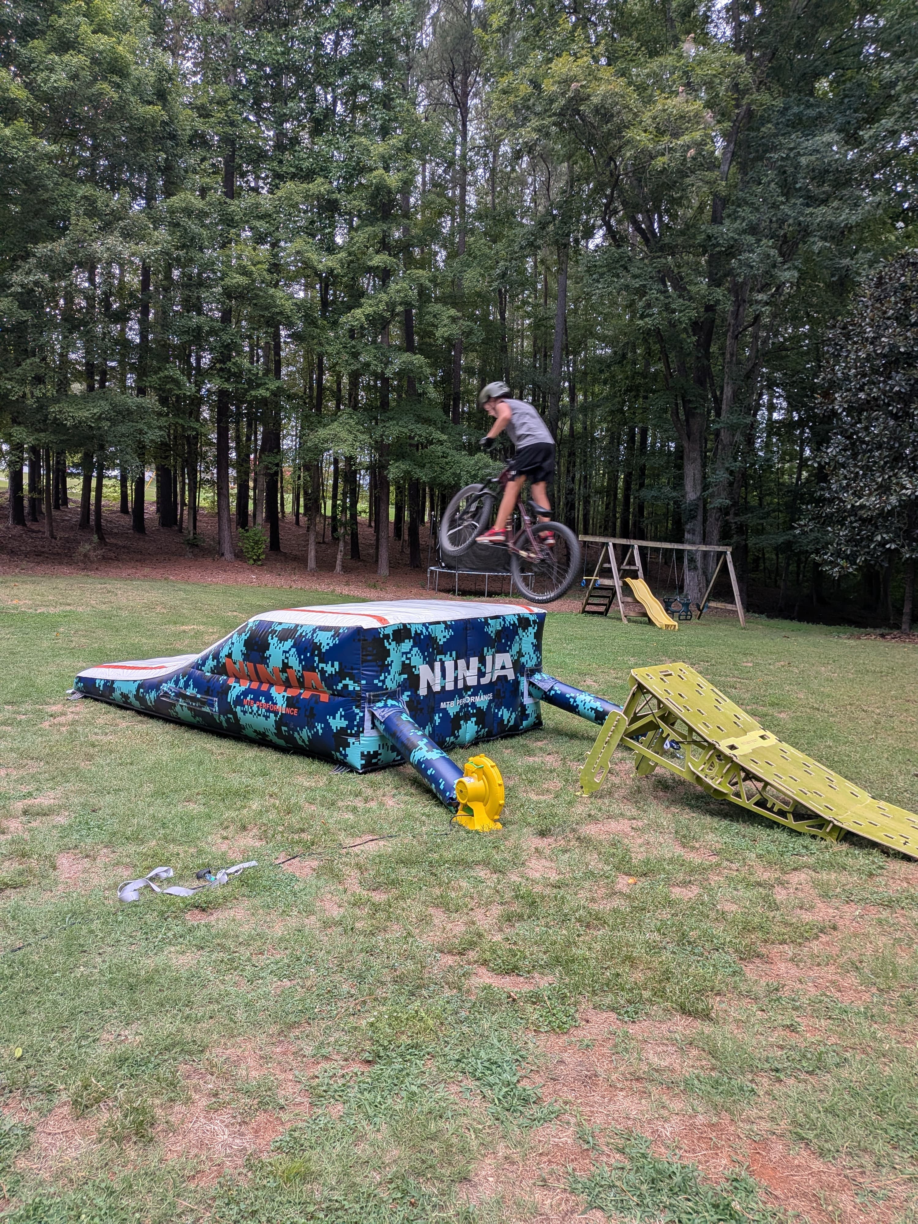 Rider jumping onto the portable air bag landing