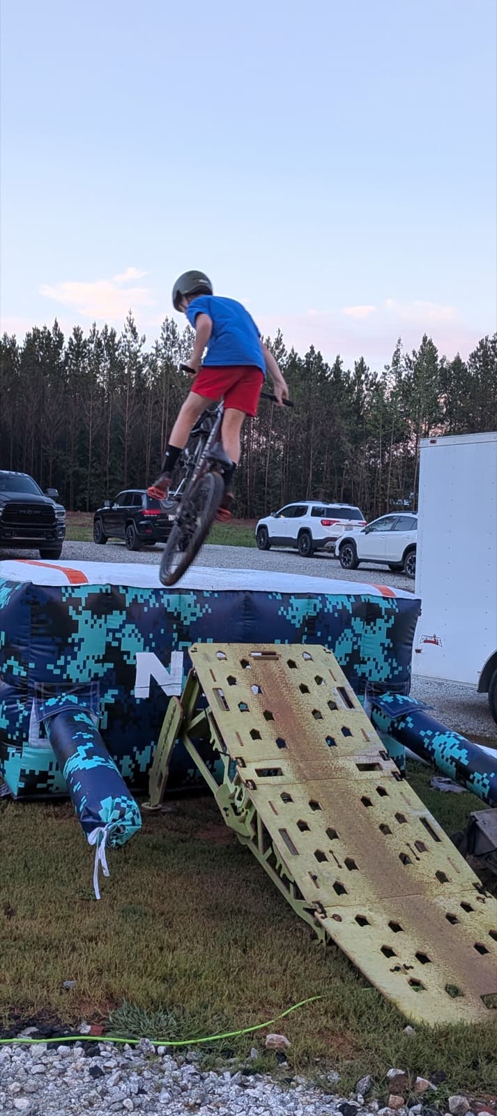 Rider launching from the portable ramp onto the air bag
